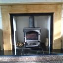 Fireplace with plain oak surround