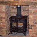 Herald stove in open brick