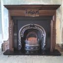 Original surround with reproduction cast iron arch